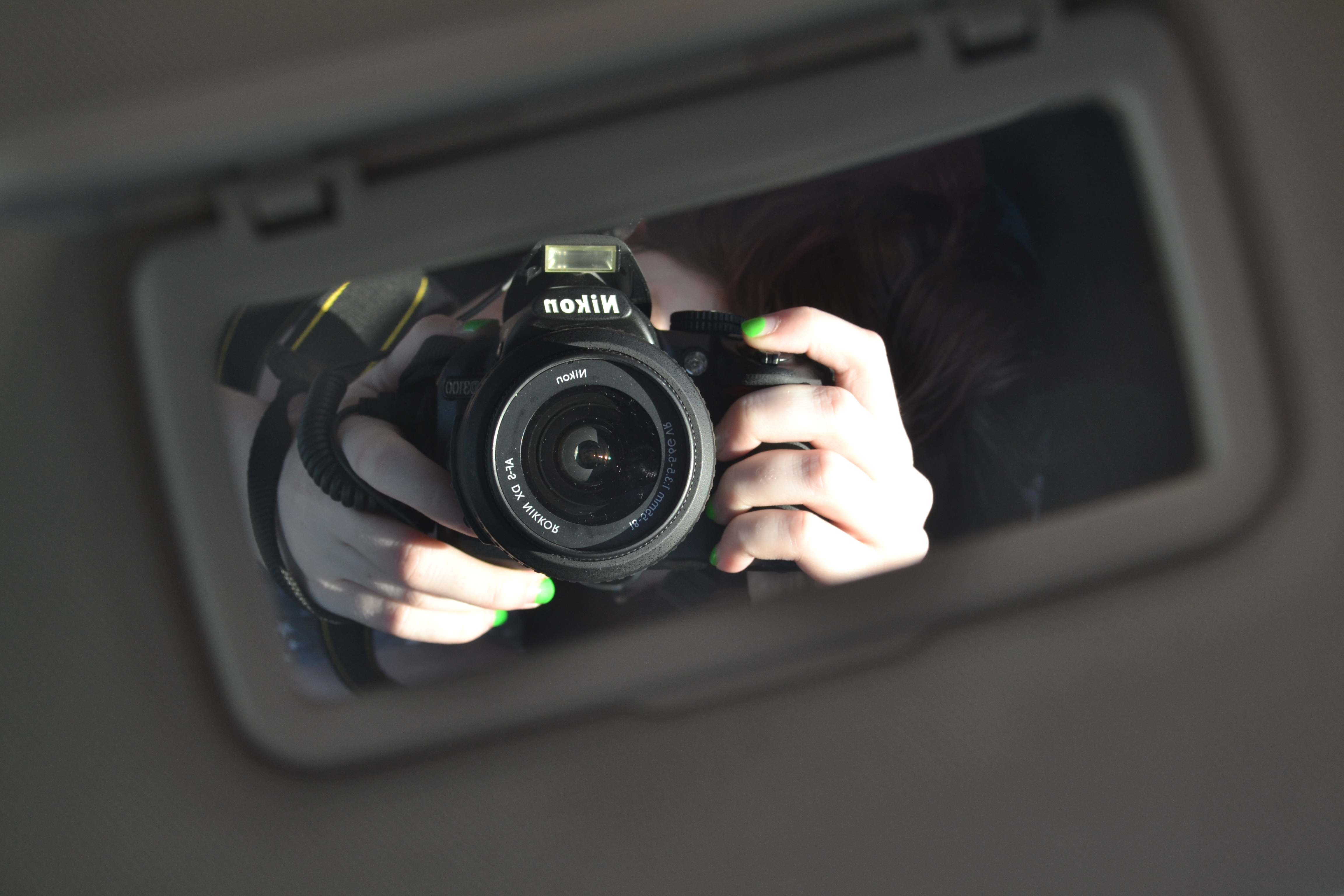 Nikon camera being held up to capture a photo